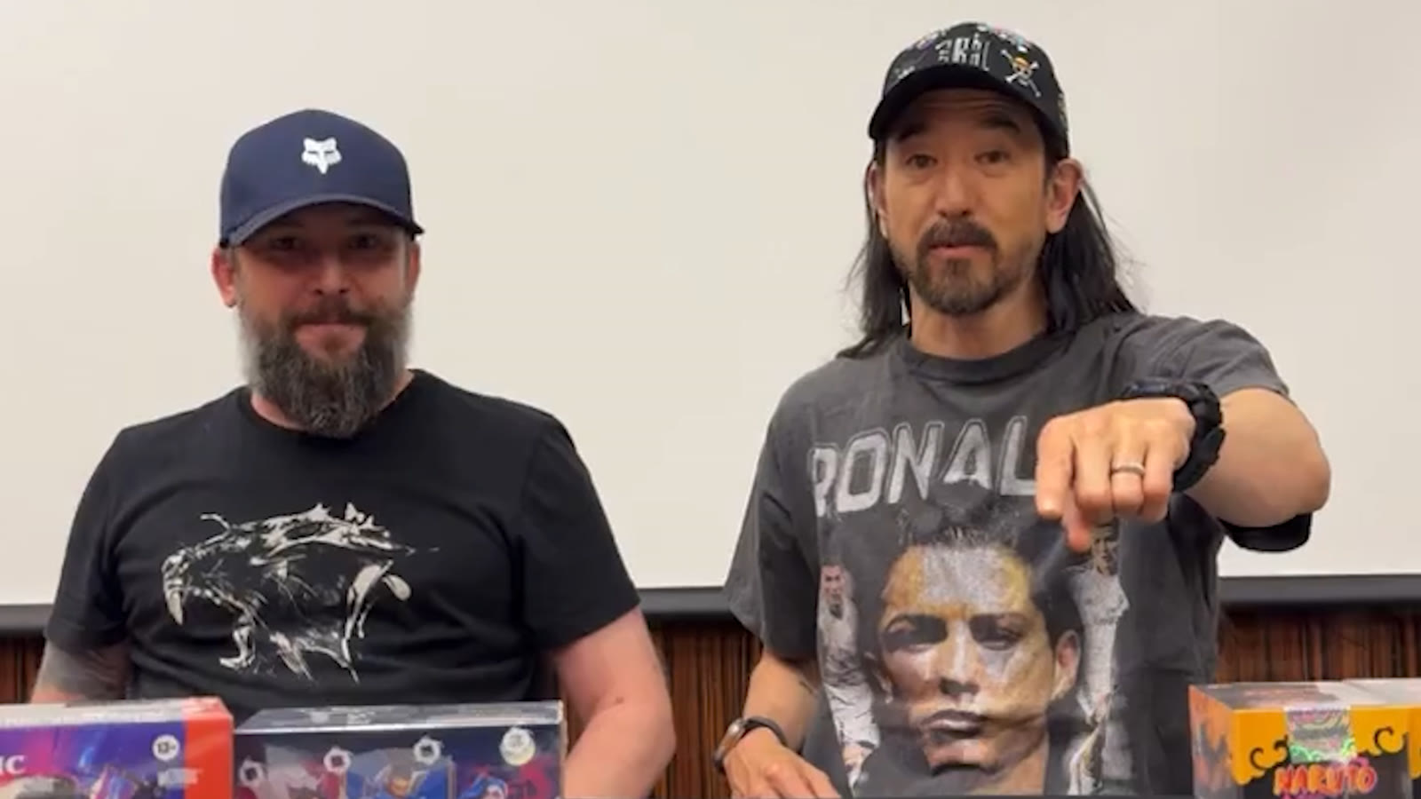 Gamerz Center and Steve Aoki opening TCG packs live during UNTOLD ONE weekend